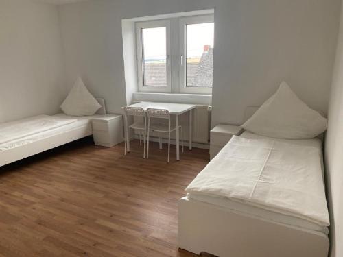Schicke Monteurunterkunft in Mendig mit drei Wohneinheiten客房内的一张或多张床位