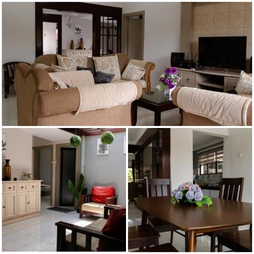 Kampong Alor GajahPoolhomestay Raudhah Intan的客厅配有沙发和桌子