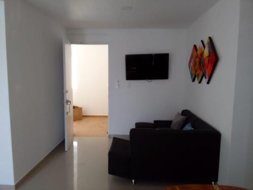 Hermoso Apartamento en Caribe Campestre的休息区