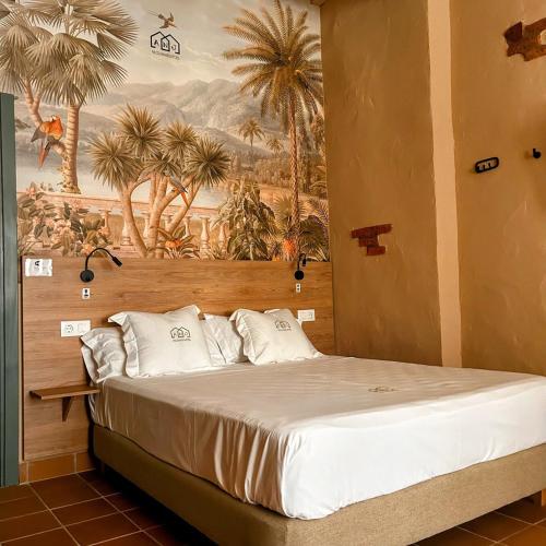 瓜达卢佩ANJ ESTUDIO TEMPLETE的一间卧室配有一张壁画床