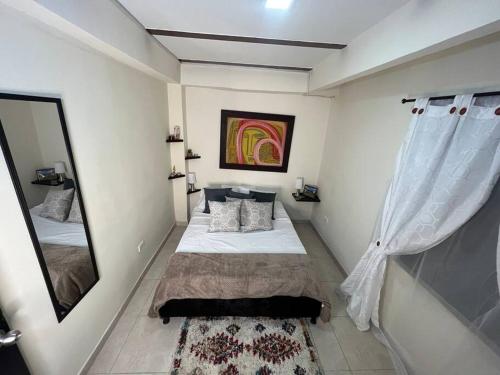 Apartamento cacique calarca客房内的一张或多张床位