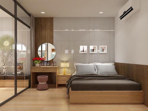 绥和市Dinh’s Aparment的一间卧室配有一张大床和镜子