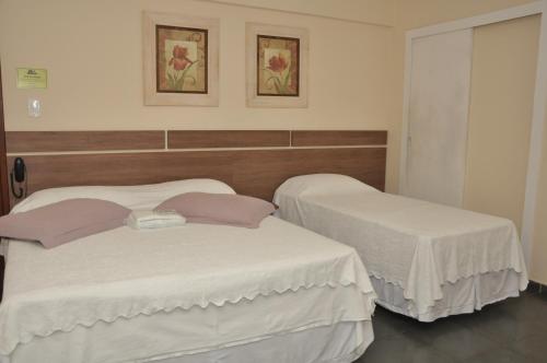 Hotel Pousada Figueiredo客房内的一张或多张床位