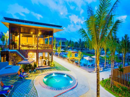 富国Sonaga Beach Resort & Villas Phu Quoc的游泳池度假村的形象