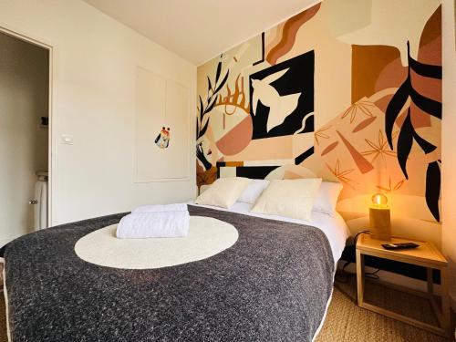 Appartement cosy, Duck, Secteur Boinot - wifi, netflix, prime vidéo客房内的一张或多张床位