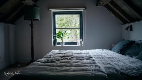 Het Ovenhuisje客房内的一张或多张床位