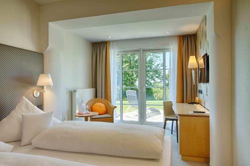 多瑙沃特公园酒店客房内的一张或多张床位