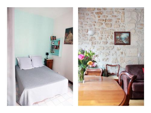 巴黎拉丁区 - 巴黎圣母院公寓的一间卧室和一间带一张床及一张桌子的客厅