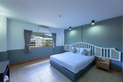 Nora Bukit Hotel客房内的一张或多张床位