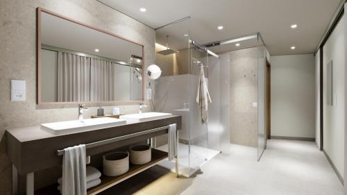 戈梅拉岛圣塞瓦斯蒂安BANCAL HOTEL and SPA的一间带水槽和镜子的浴室