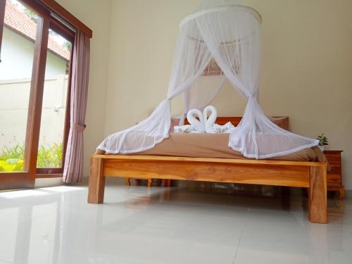 Ubud nadi villa客房内的一张或多张床位