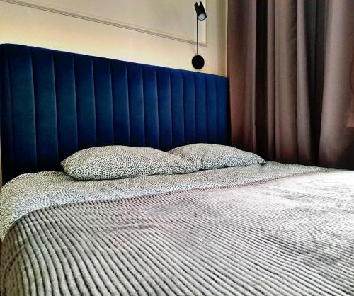 Kopernik Premium Rooms Apartment客房内的一张或多张床位
