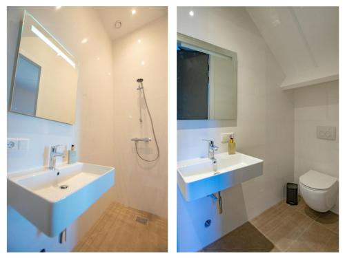 Lage ZwaluweJonkershof的一间带两个盥洗盆和卫生间的浴室