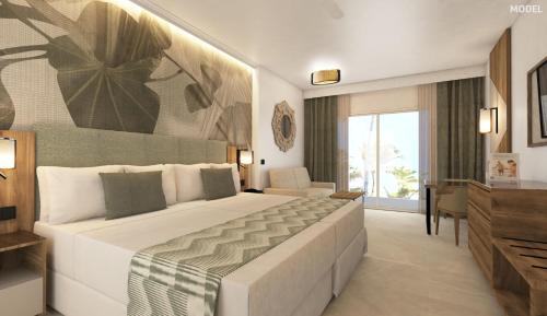 勒莫尔尼Riu Palace Mauritius - All Inclusive - Adults Only的一间卧室,卧室内配有一张大床