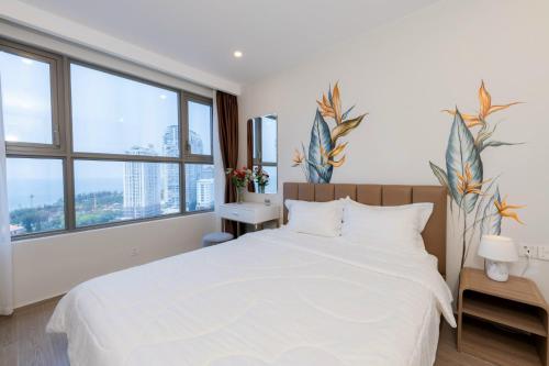 CONDOTEL 5 SAO THE SÓNG VŨNG TÀU Mr VƯƠNG VIP KHÔNG THANH TOÁN TRƯỚC客房内的一张或多张床位