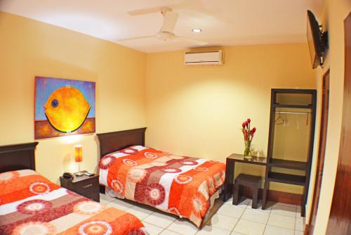 Hotel Plaza Cosiguina客房内的一张或多张床位