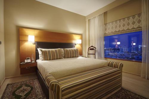 钦奈图尔亚 - OMR IT高速公路酒店客房内的一张或多张床位
