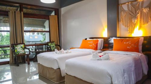 Daluyong Beach Resort客房内的一张或多张床位