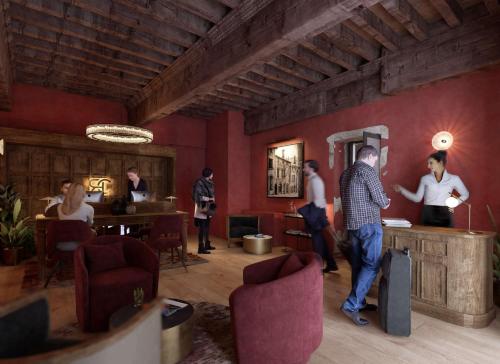 里昂Cour des Loges Lyon, A Radisson Collection Hotel的一群人住在一个红色墙壁的房间