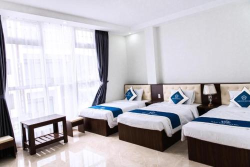 Bảo Sơn Hotel客房内的一张或多张床位