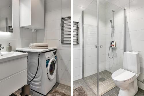 斯德哥尔摩Cosy Urban Home in Stockholm的白色的浴室设有卫生间和洗衣机。