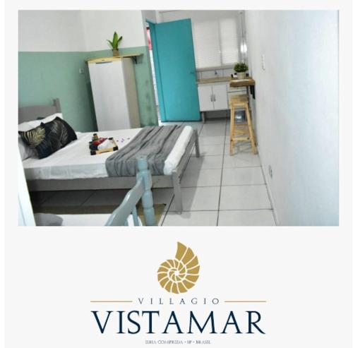 伊利亚孔普里达Villagio Vistamar Ilha Comprida的小房间设有床和厨房