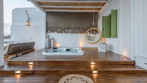 阿波罗尼亚villa lord的客房铺有木地板,设有热水浴池。