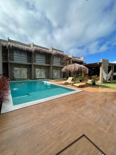 圣米格尔-杜斯米拉格里斯Nauru chalés milagres的一座带游泳池的房子的图象