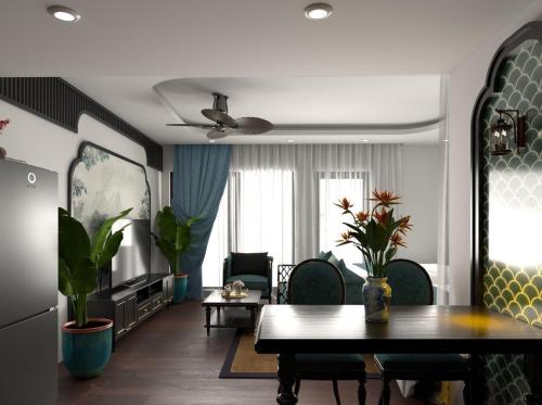 归仁Hanie Apartment - FLC Sea Tower Quy Nhon的一间带桌子的客厅和一间餐厅