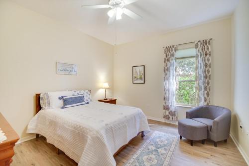 Merritt IslandRanch-Style Florida Retreat with Pool and Lanai的卧室配有床、椅子和窗户。