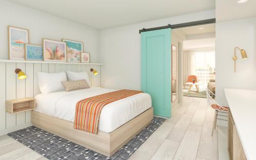 威尔伍德克拉斯特Madison Resort Wildwood Crest的一间卧室配有一张床和一个蓝色的门