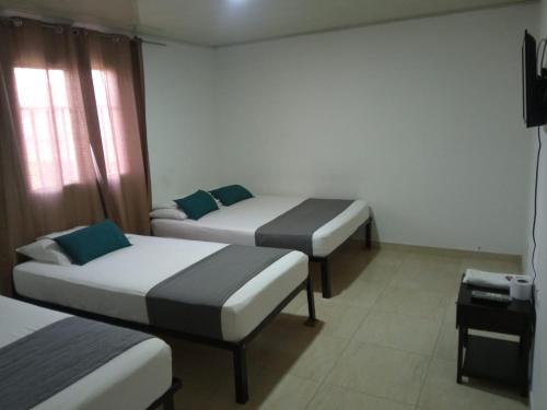 Hotel Casa Guajira Real客房内的一张或多张床位
