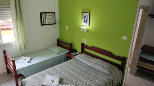 HOTEL SÃO NICOLAU客房内的一张或多张床位