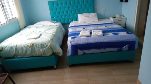 Hospedaje La Ola Azul客房内的一张或多张床位