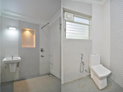 卡兰古特Calangute By Goa Journey的白色的浴室设有卫生间和水槽。
