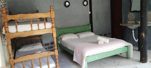 Hostel Recanto Caiçara客房内的一张或多张床位