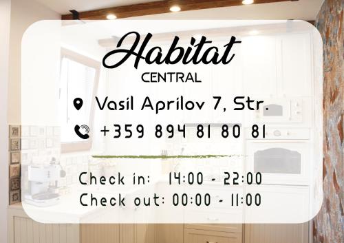 鲁塞Habitat Central Apartment的显示厨房的窗口,上面有读取阿拉伯文中央出租的标志