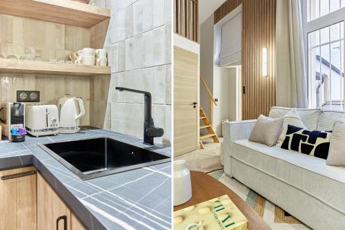巴黎Apartment Batignolle Montmartre by Studio prestige的一间带水槽的厨房和一间带沙发的客厅