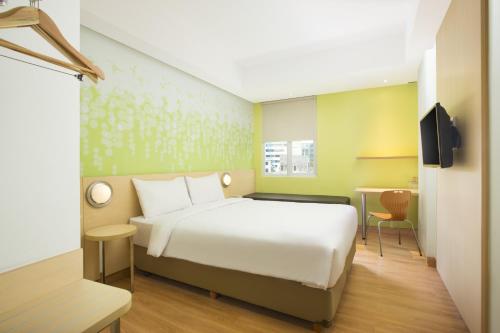 Zest Bogor by Swiss-Belhotel International客房内的一张或多张床位