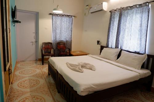 Altrude Villa Guest House Near Candolim Beach客房内的一张或多张床位