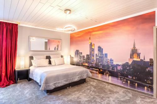 吕塞尔斯海姆PMC商务公寓的一间拥有城市大型壁画的卧室