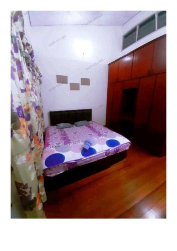 怡保AABM DELIMA HOMESTAY的卧室配有一张床