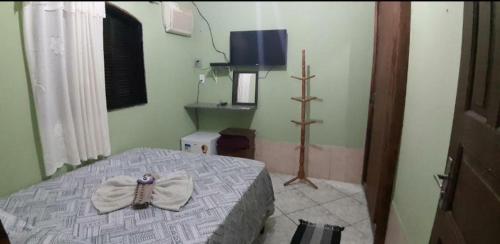 Suítes Pouso do Sol客房内的一张或多张床位