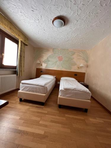 Hotel Breuil客房内的一张或多张床位