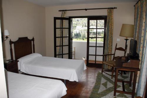 Villa Turística de Grazalema客房内的一张或多张床位