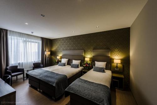 OZO Hotels Arena Amsterdam客房内的一张或多张床位