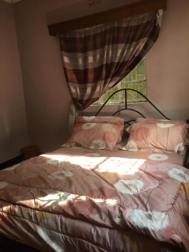 Arusha homestay客房内的一张或多张床位