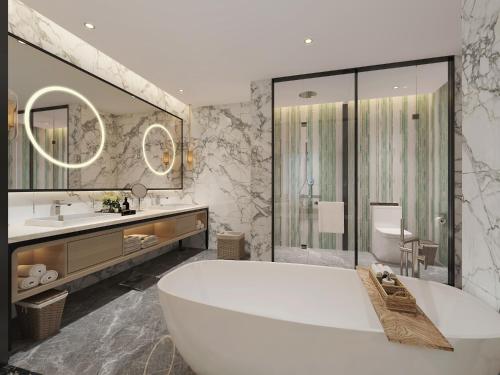 内罗毕内罗毕机场雅阁大酒店的带浴缸、盥洗盆和卫生间的浴室