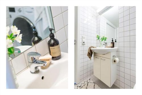 奥斯陆Luxurable super central 3 BR apt for a family of 6 in Oslo的一间带水槽和一瓶葡萄酒的浴室