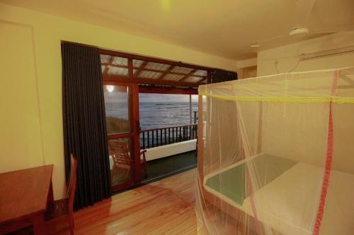 韦利格默New Ocean Vibes的客房设有海景阳台。